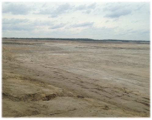 Dry tailings. Looks like an empty field