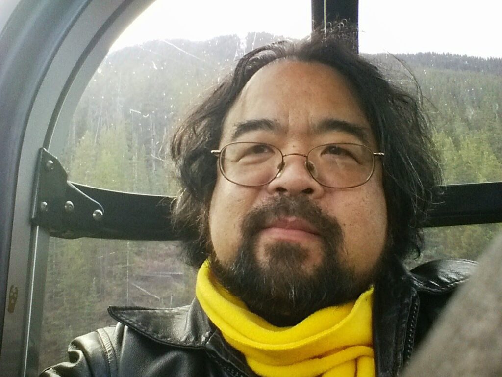 headshot of Cam Tsujita