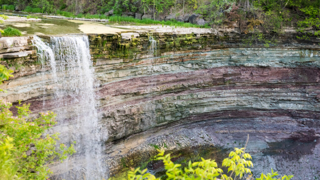 Twenty Mile Falls showing exposed rock units behind the waterfall