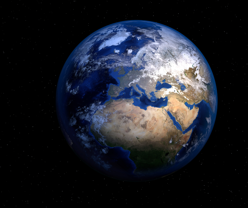 The Earth from a distance showing blue water and light coloured continents on a black background