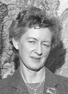 Headshot of Dr. Frances Wagner. The photo is in black and white and she is standing in front of a map.
