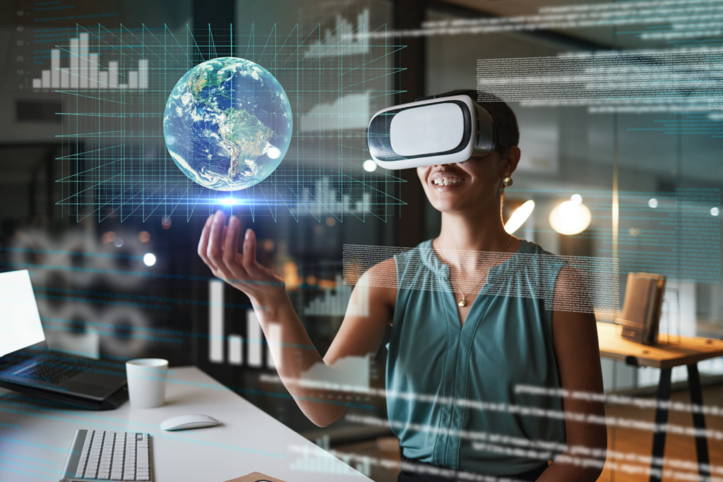 Person wearing VR goggles holding a virtual earth in their hand
